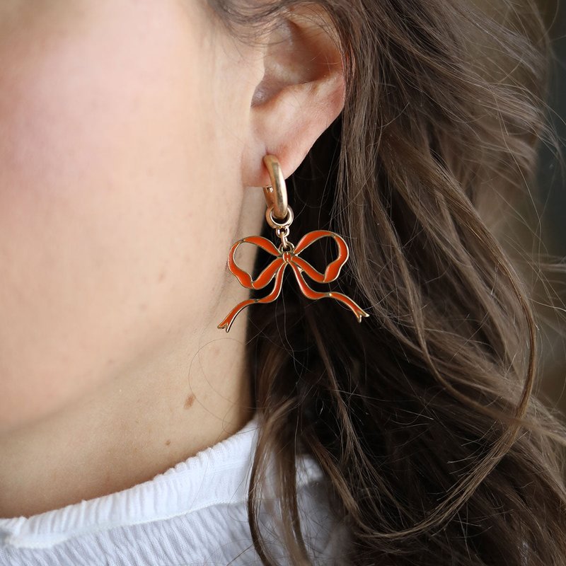 Shop Canvas Style Veronica Game Day Bow Enamel Earrings In Orange