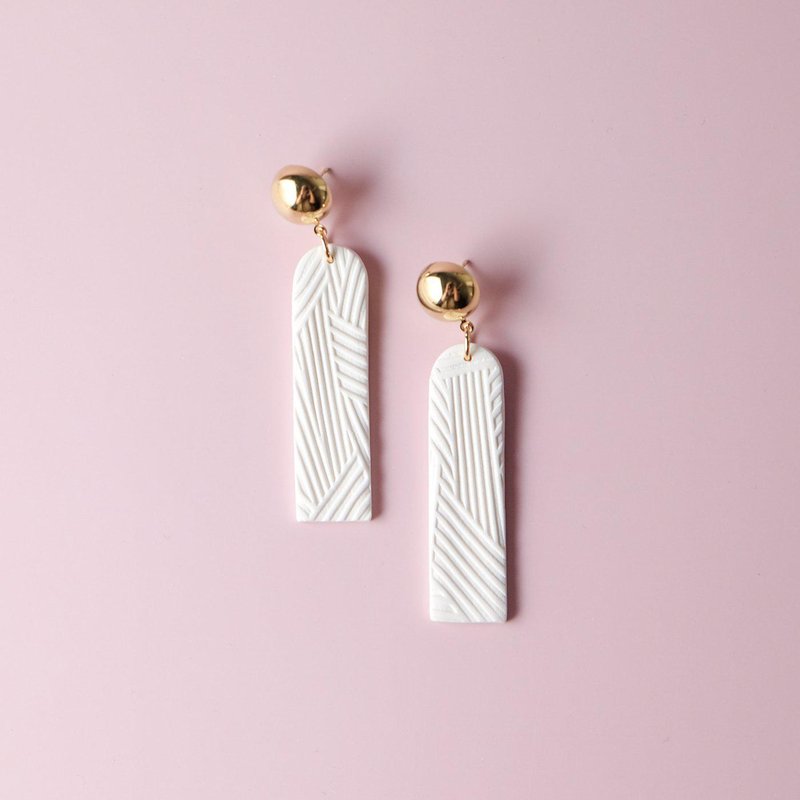 By Chavelli Textured White And Gold Dangly Earrings