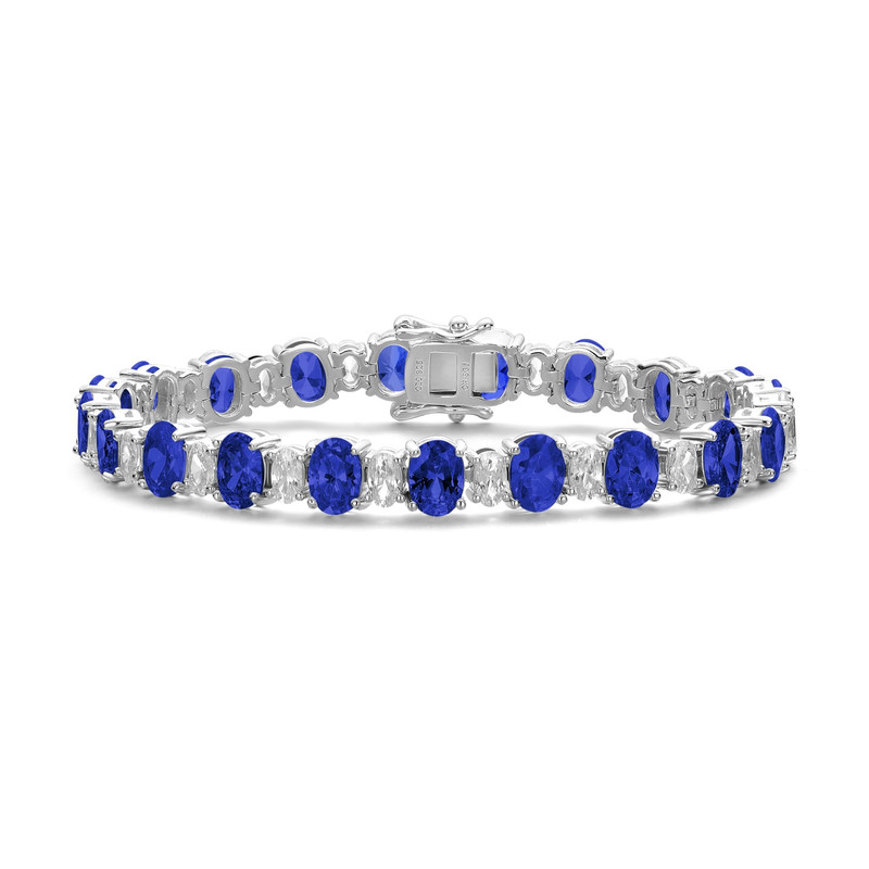 Shop Genevive Sterling Silver With Oval Colored & Clear Cubic Zirconia Tennis Bracelet In Blue