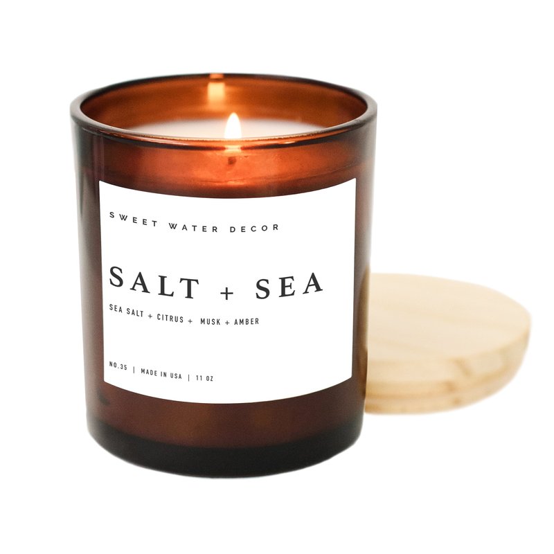 Sweet Water Decor Salt + Sea Soy Candle | 11oz Amber Jar Candle In Brown